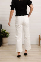 Back view of Person wearing white pants