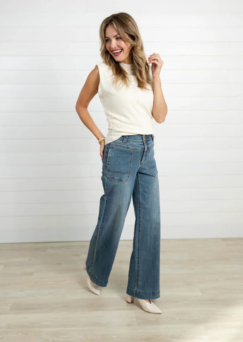Alt view of model wearing jeans and a white tank 