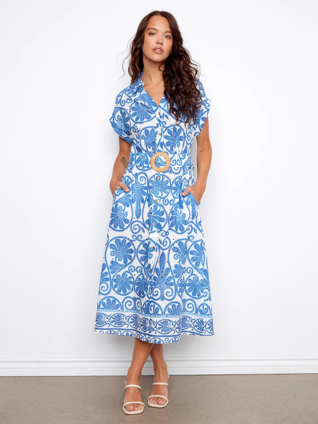 Woman wearing a blue and white patterned dress 