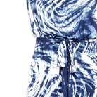 Close-up of a blue and white tie-dye patterned garment with a matching waist tie belt, shown against a plain white background.