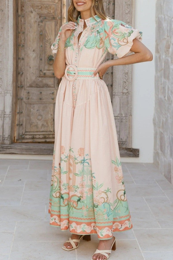 Woman wearing a floral dress with bet 