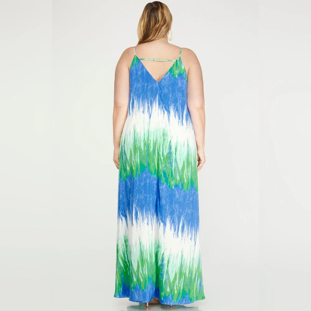 Back of woman wearing a  dress with blue, green, and white gradient 