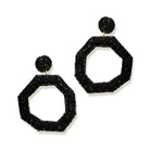 BLACK EARRINGS ON A WHITE BACKGROUND