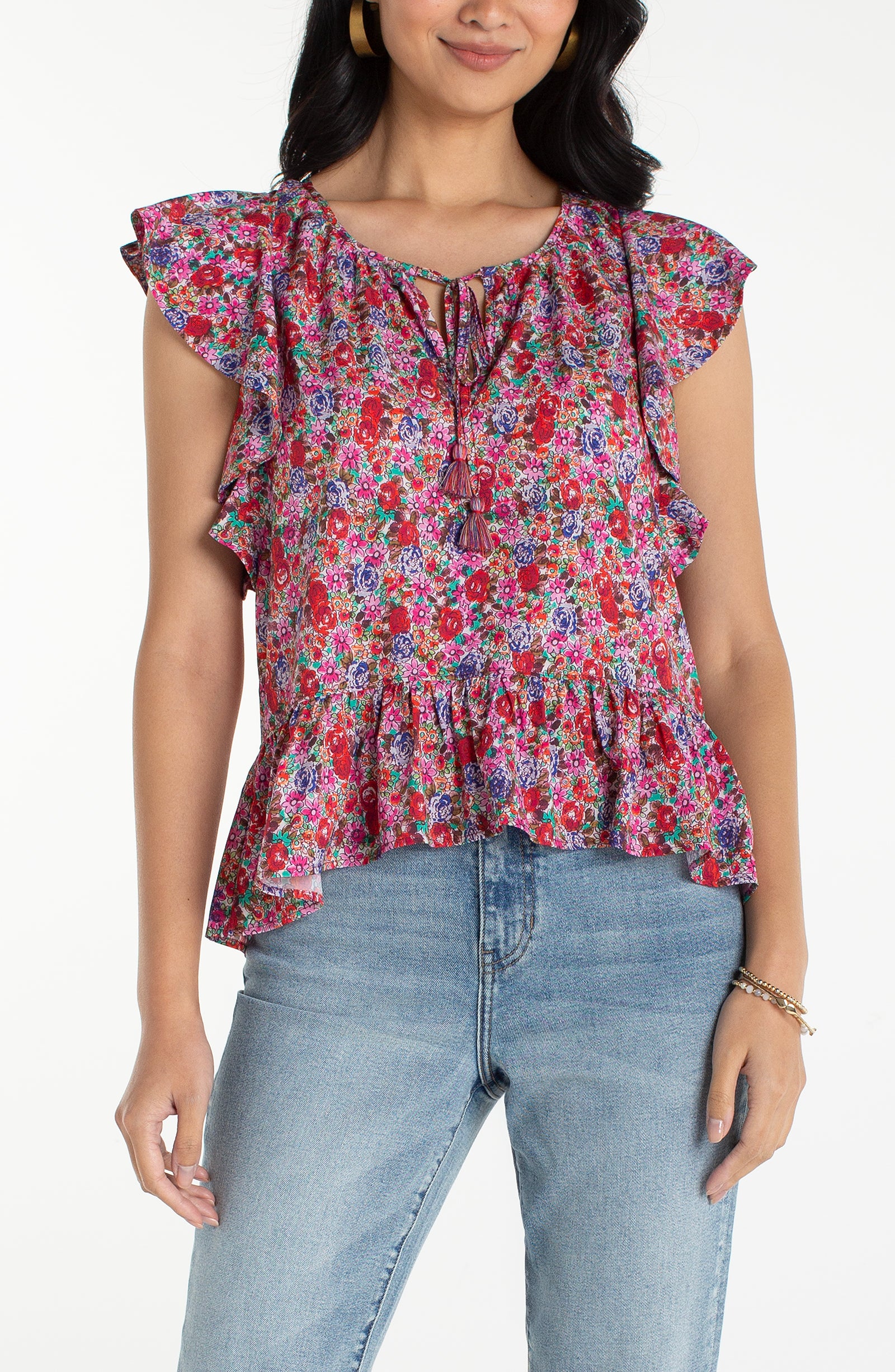 Woman wearing a colorful floral blouse 