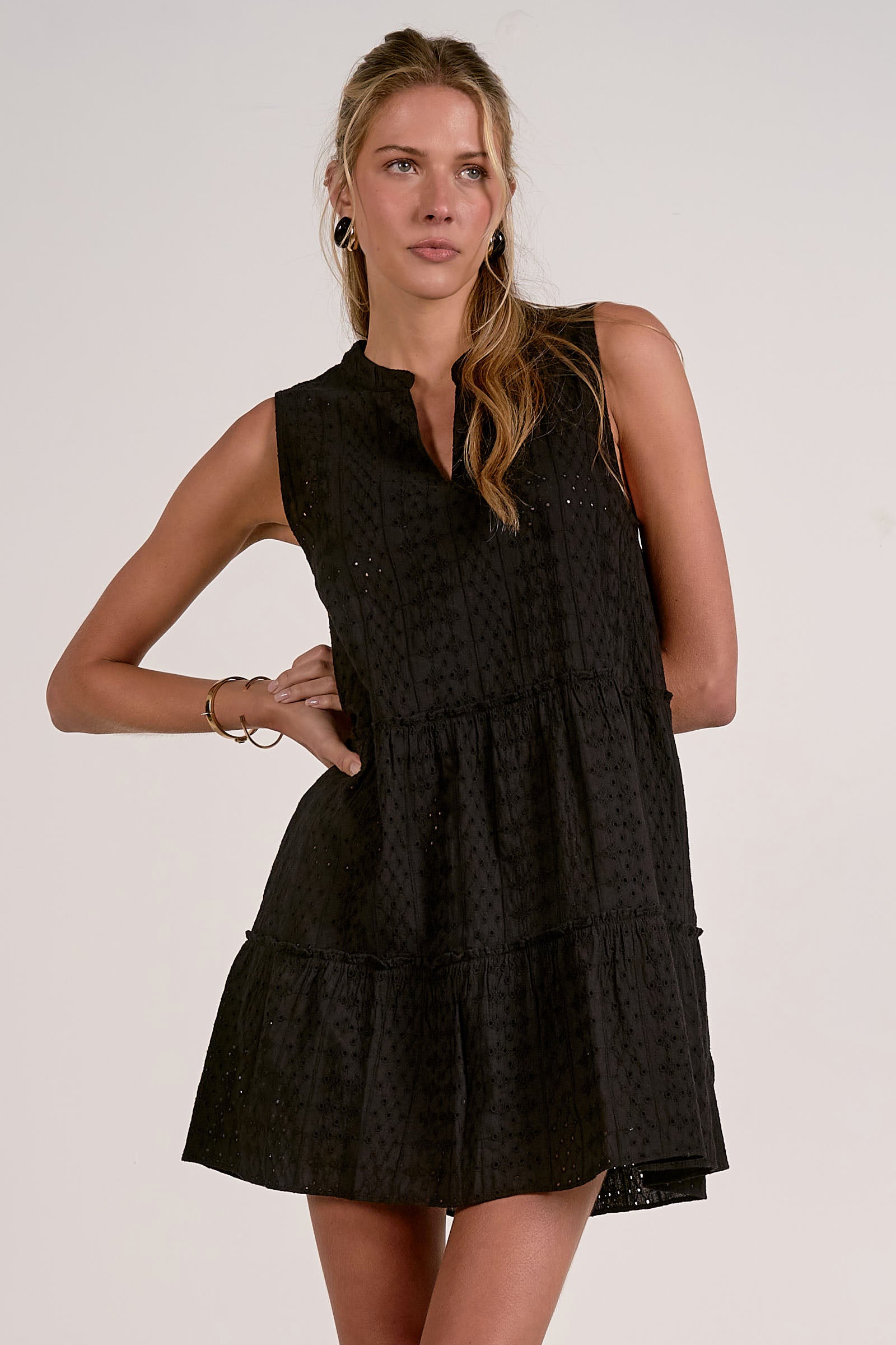 Woman wearing a black sleeveless dress 