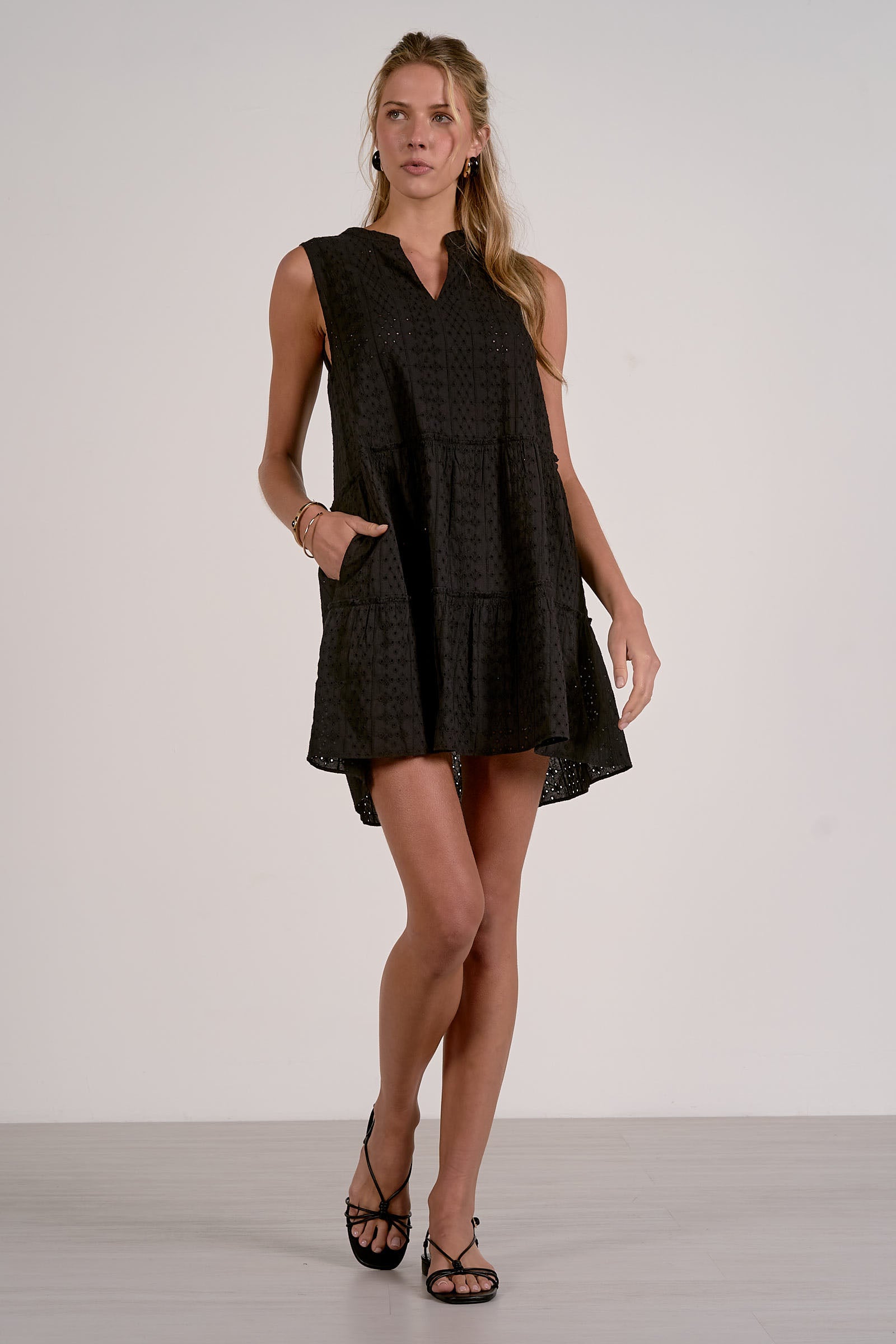 Woman wearing a black sleeveless dress