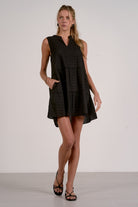 Woman wearing a black sleeveless dress